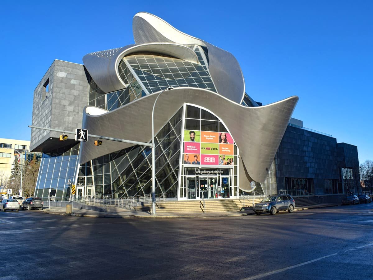 A large building with a curved roof on a street corner: date idea in Alberta