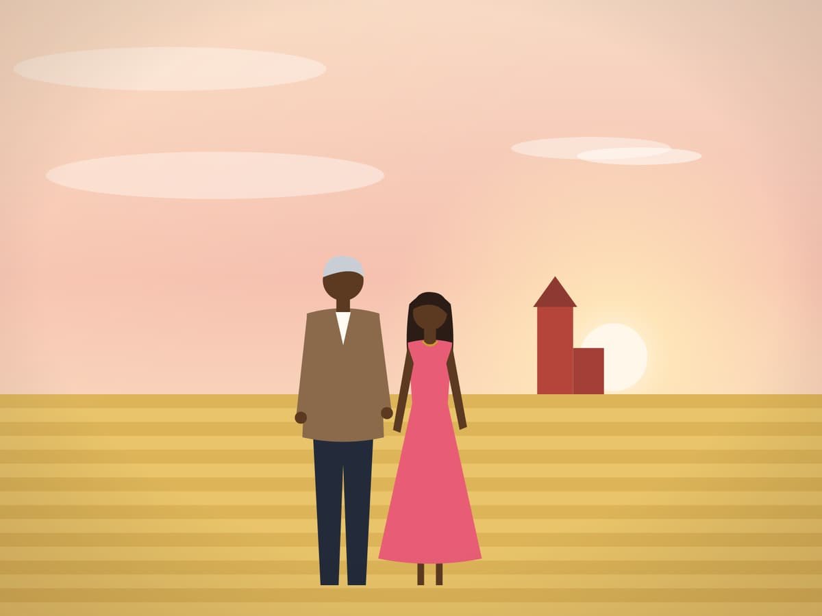 Couple watching a golden prairie sunset beside a wheat field
