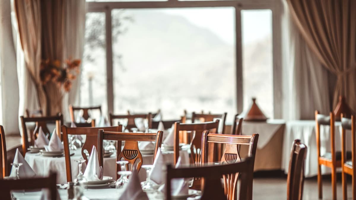 Brown wooden dining set inside room