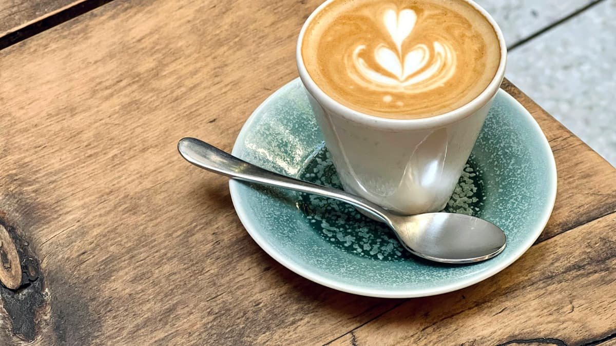 A cup of coffee with a spoon