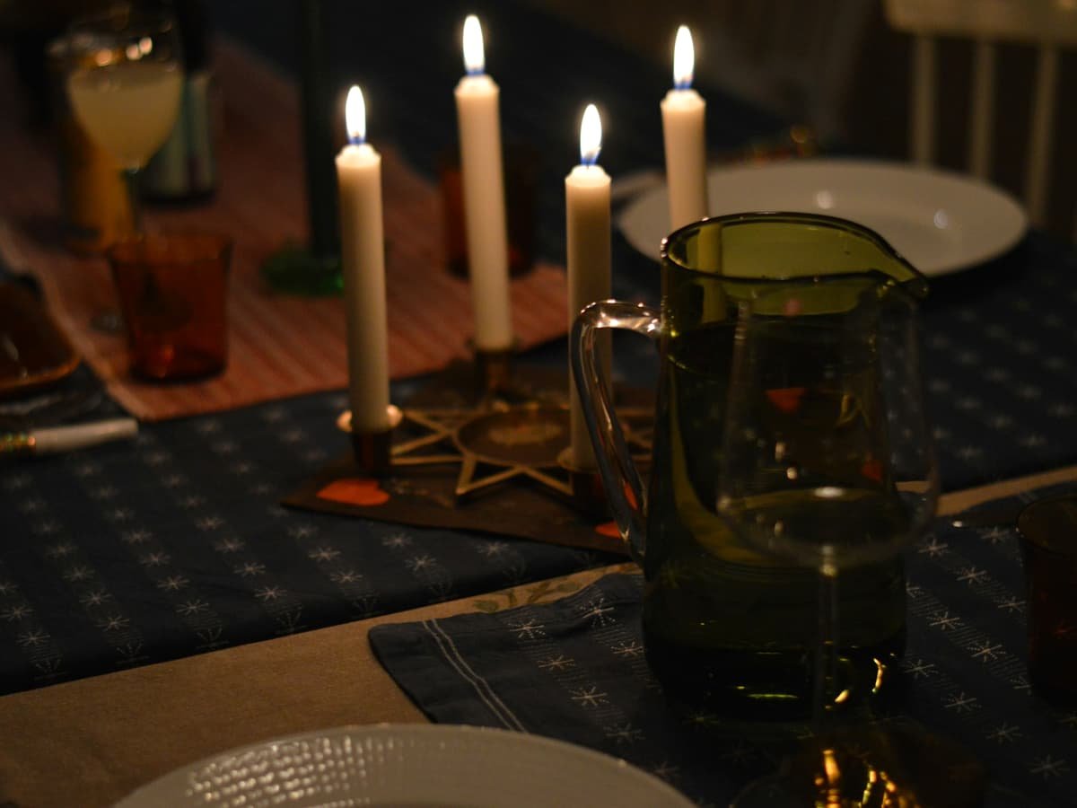 Candles lit on a dinner table setting: date idea in British Columbia