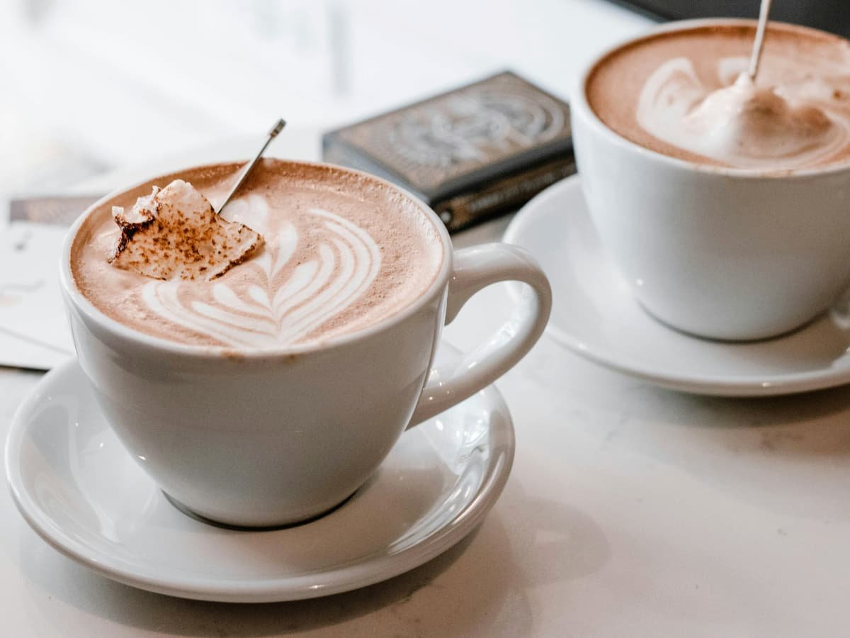 Two white ceramic cups with saucers: date idea in British Columbia