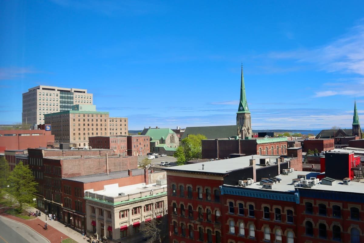 A view of a city with tall buildings in Heritage streets of Uptown Saint John, New Brunswick