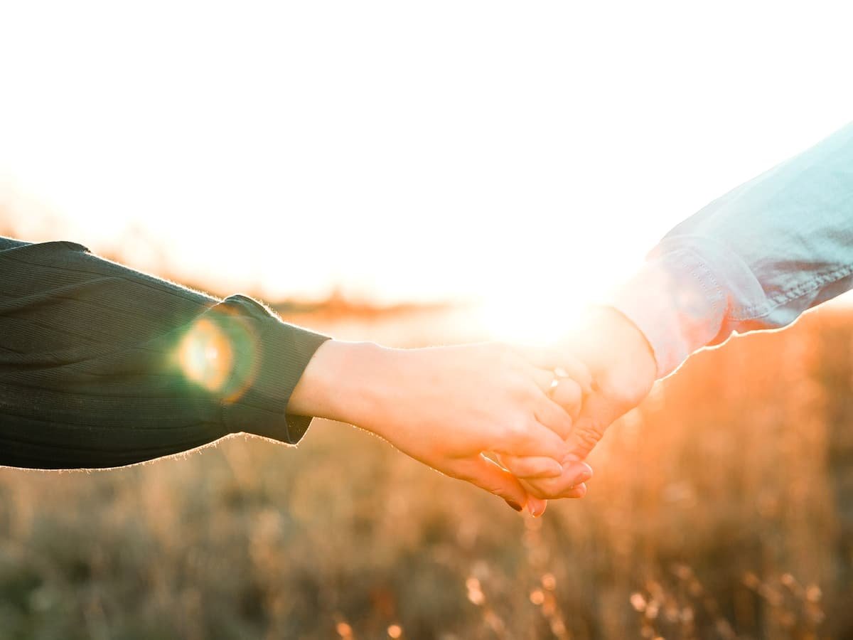 Two person holding each other's hands: date idea in Newfoundland and Labrador