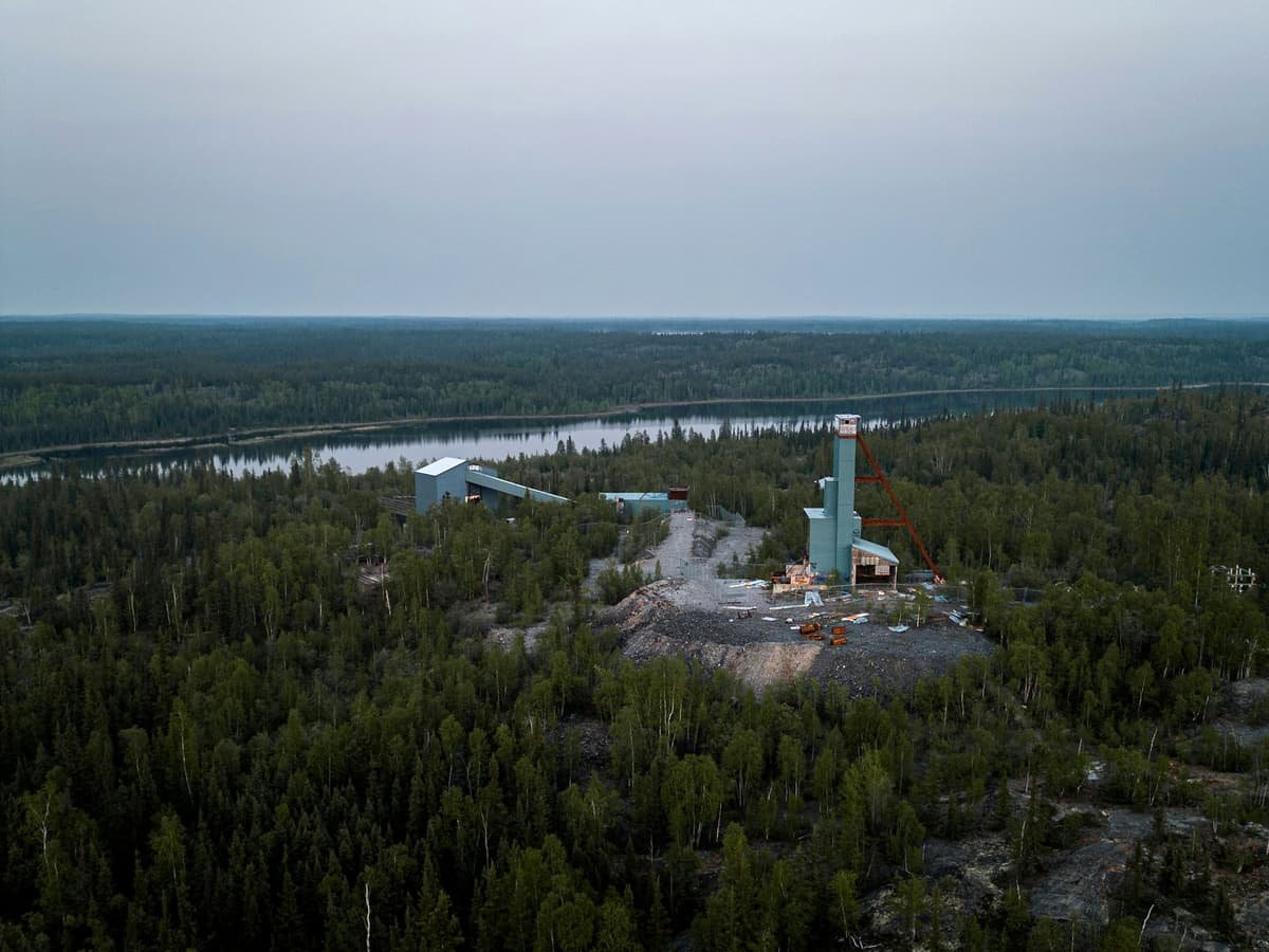An aerial view of a forest with a lake in the background: date idea in the Northwest Territories