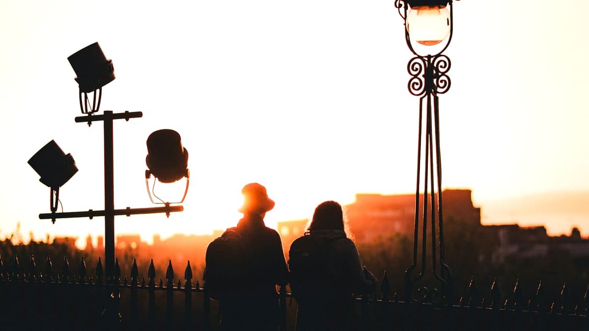 Silhouettes of two people against sunset sky, date night in the Northwest Territories