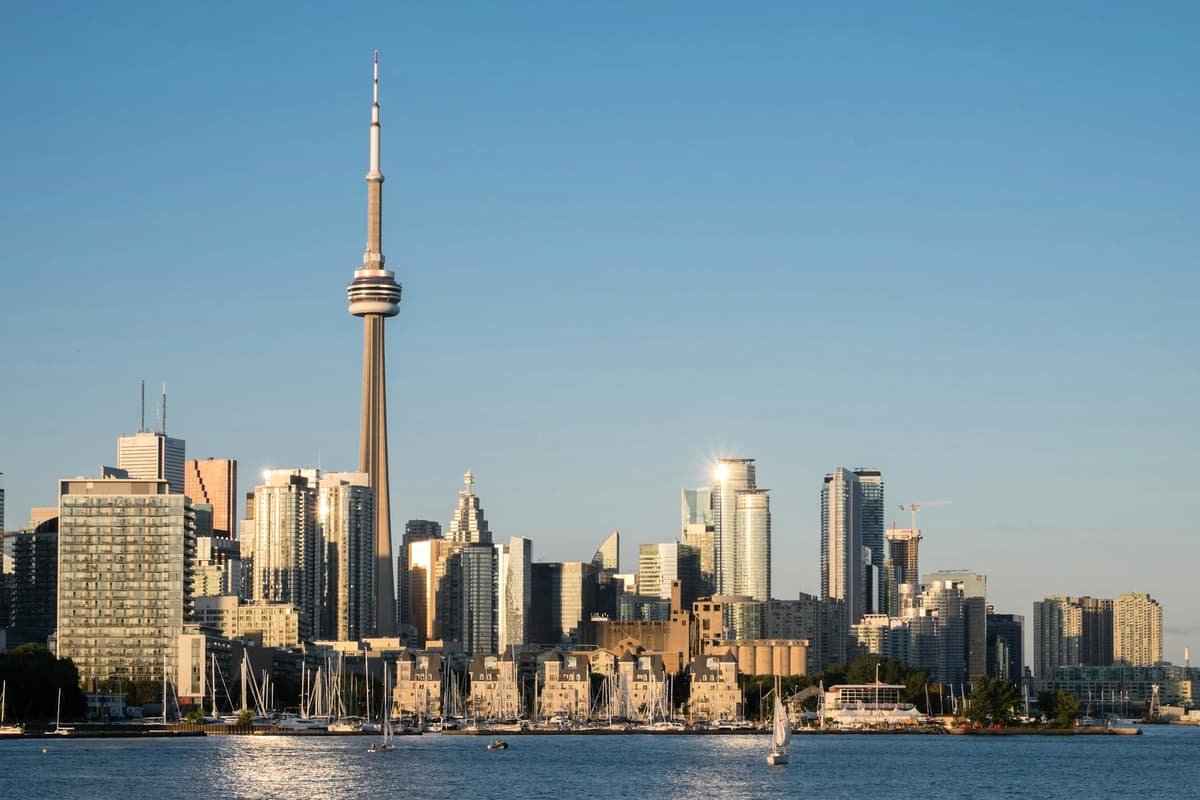 A view of a city skyline from across the water in Toronto skyline and CN Tower across Lake Ontario, Ontario