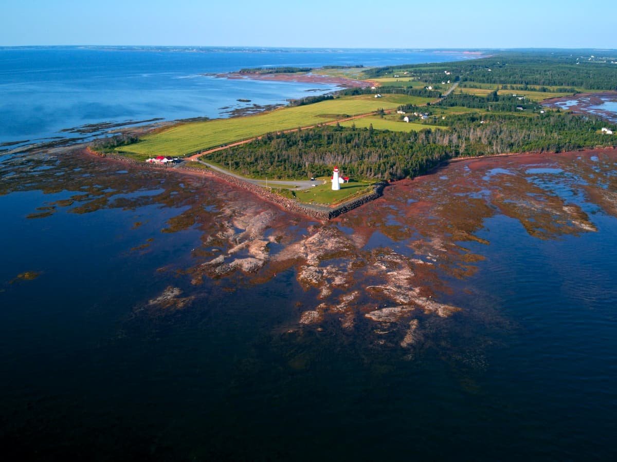 A body of water with land in the back: date idea on Prince Edward Island