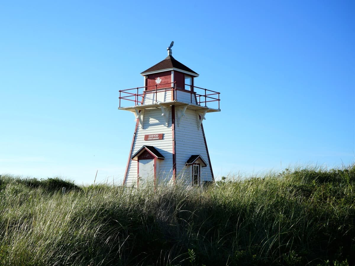 A lighthouse in a grassy area: date idea on Prince Edward Island