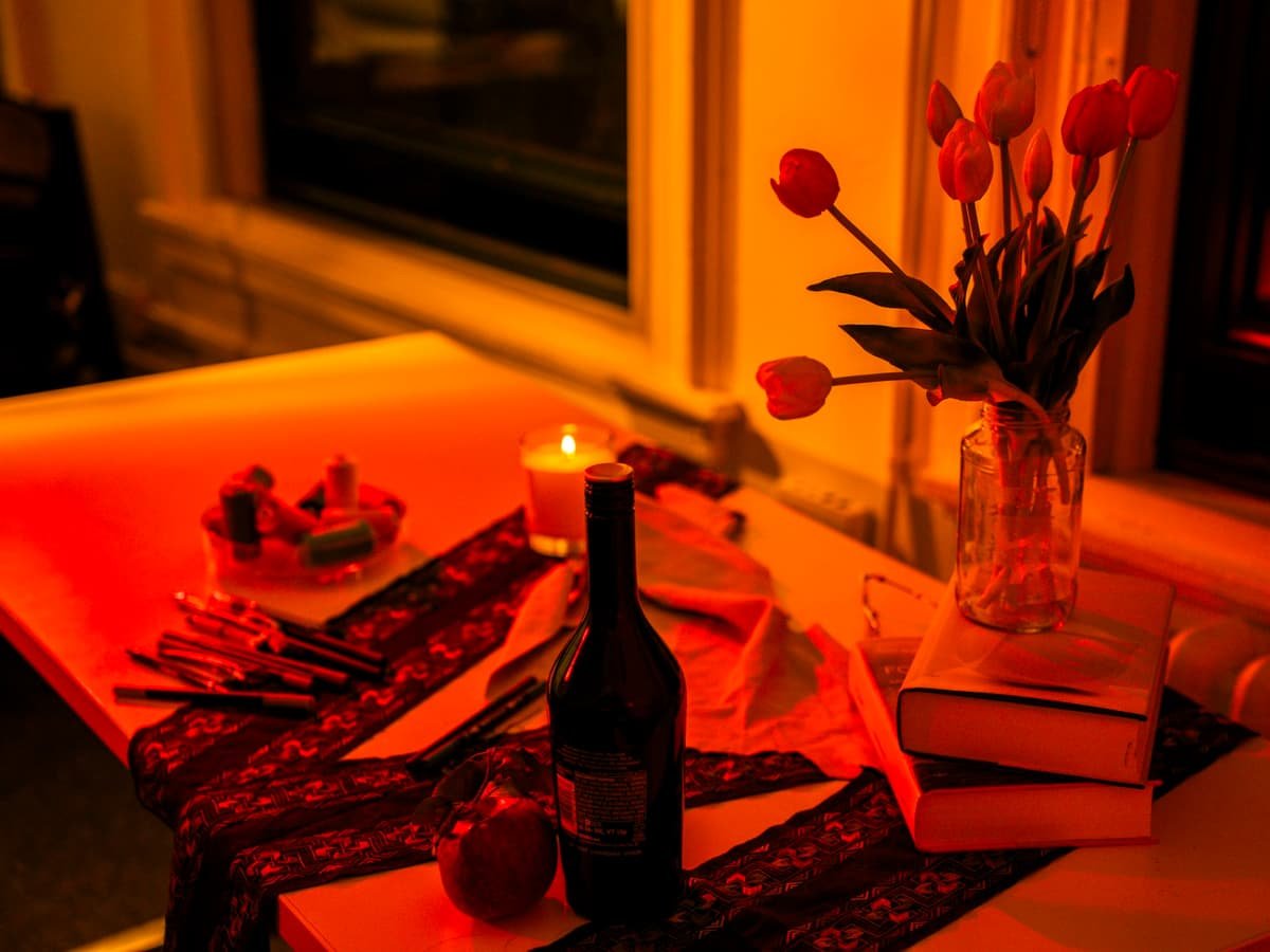 Table setting with wine, flowers, and candle: date idea on Prince Edward Island