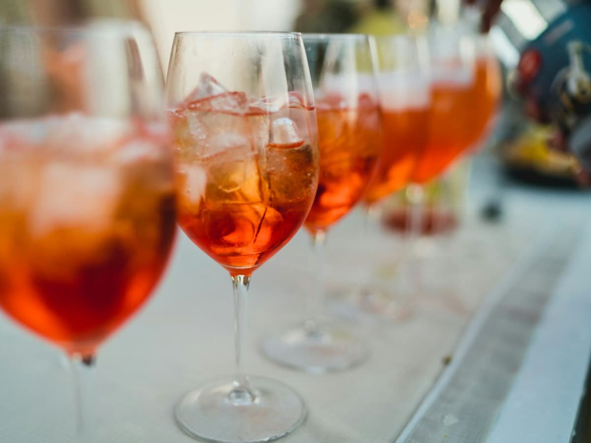 Clear wine glass with brown liquid: date idea in Quebec